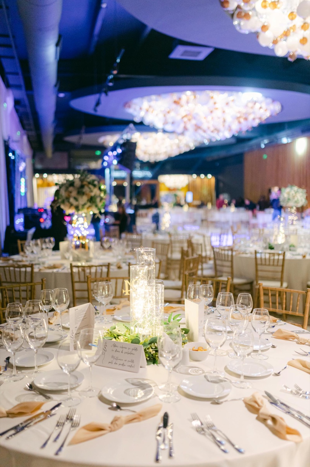 Elegant wedding reception venue with warm table lighting